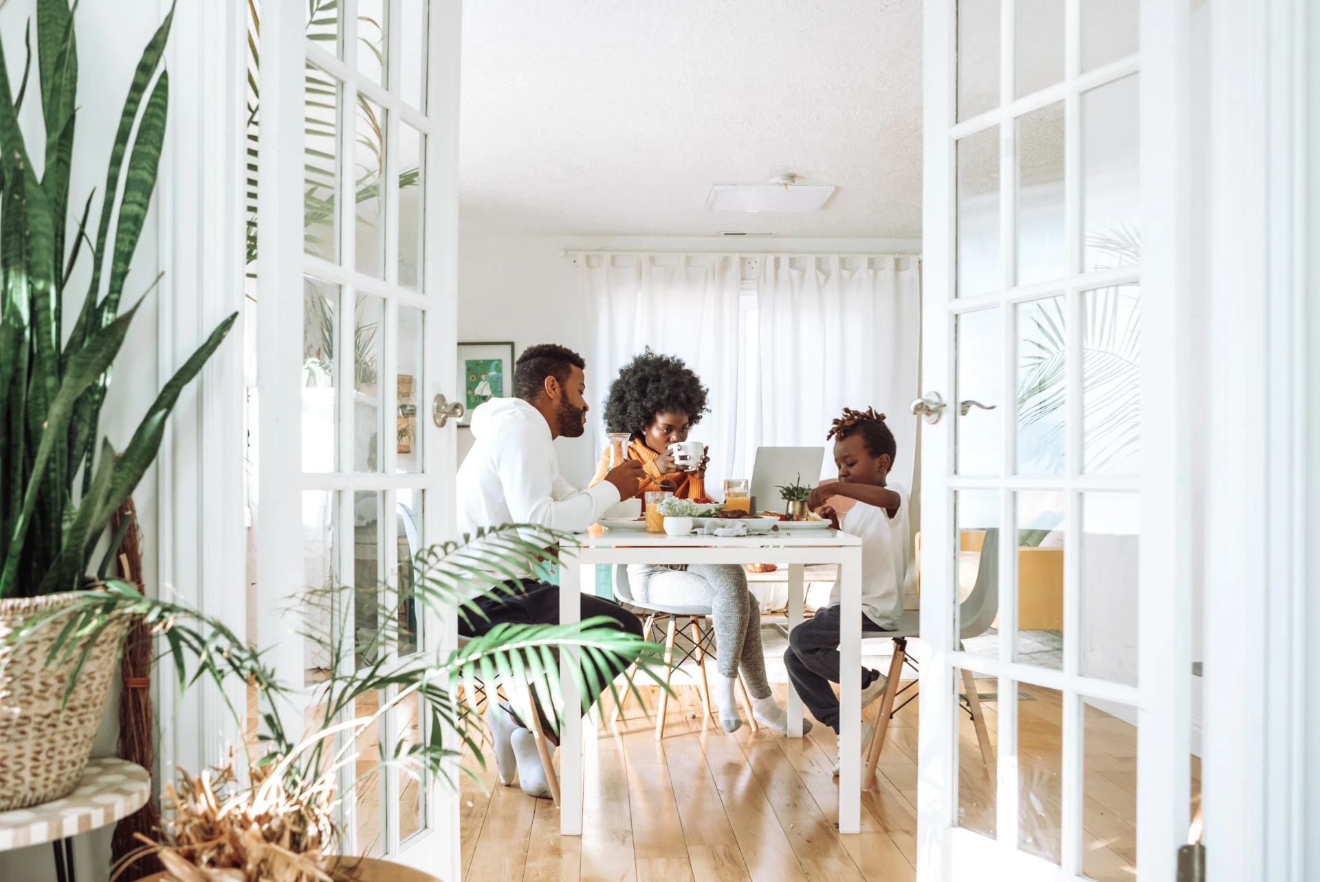 Family eating breakfast together at home